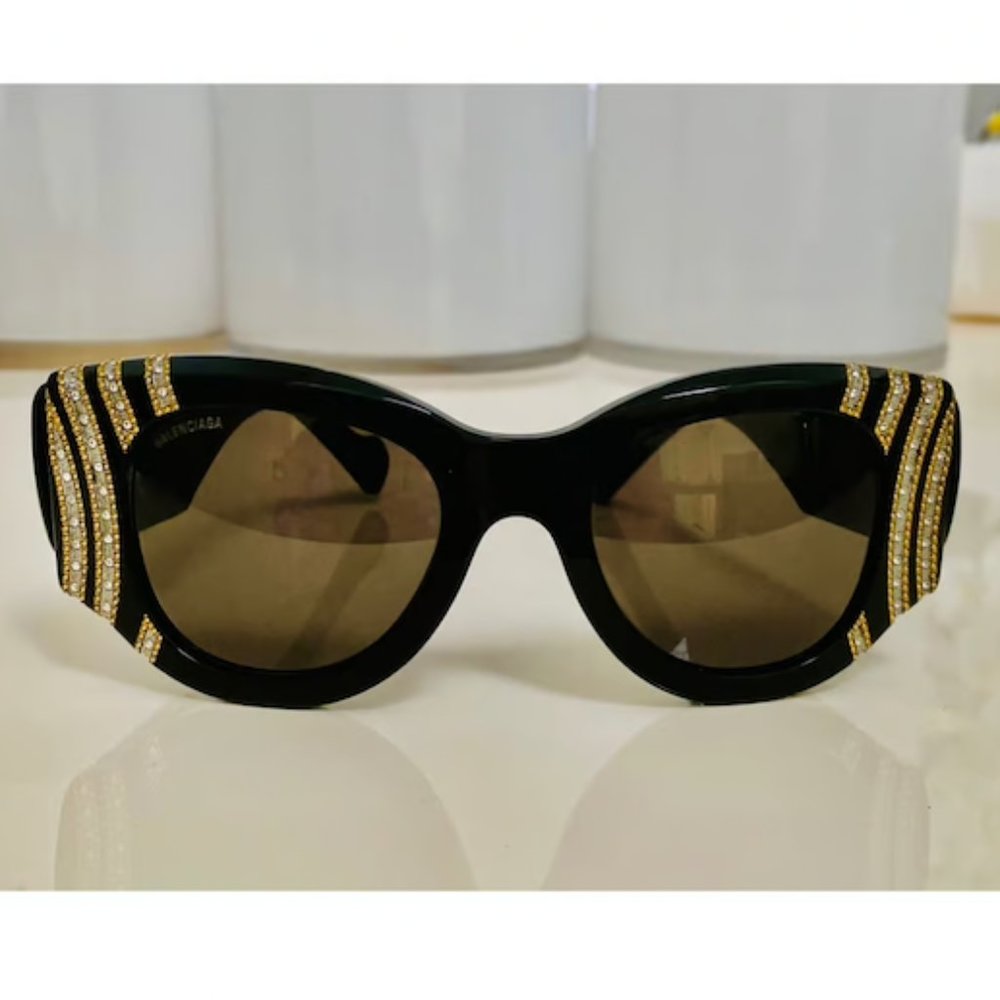 Balenciaga Black sunglasses studded with gold hardware and crystals
